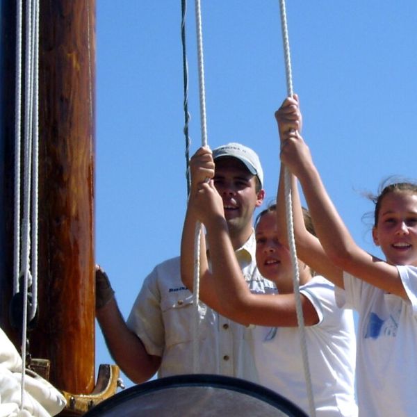 tugging on ropes on the sailboat