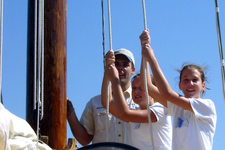 tugging on ropes on the sailboat