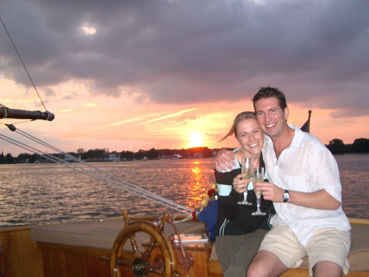 couple toasting at sunset with champagne