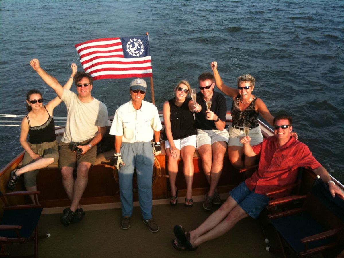 group on the back of the sailboat