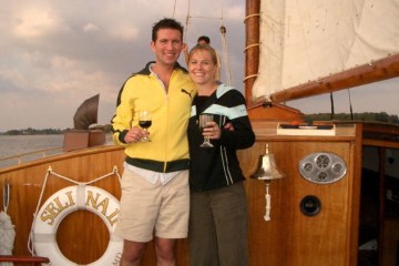 two people toasting on the sailboat