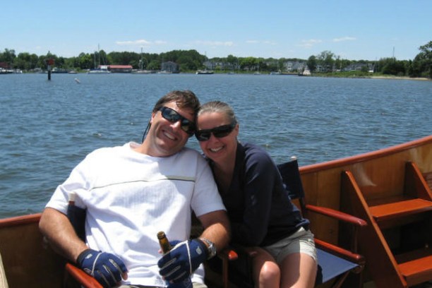 two people enjoying beer on the water