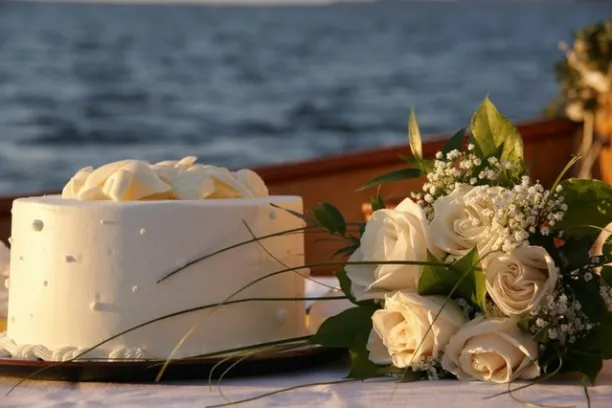 Add a touch of elegance and whimsy to your nautical wedding or elopement aboard Sail Selina in St. Michaels, MD - This exquisite nautical-themed cake with white chocolate shell decoration is just one of the many special touches you can have on your boat wedding - Book your Sail Selina adventure now!