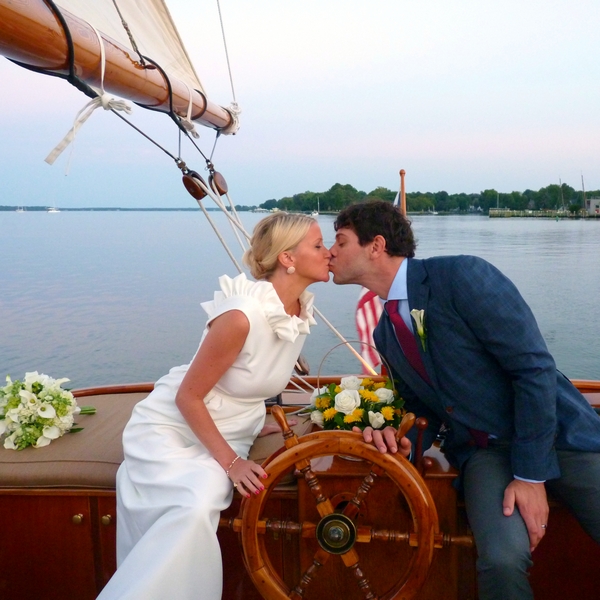 Experience the enchantment and bliss of a new marriage aboard Sail Selina in St. Michaels, MD - Capturing cherished moments like this is what makes sailing with us unforgettable - Book your Sail Selina adventure now!