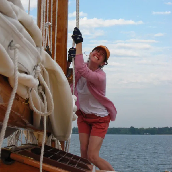 a girl learning to sail