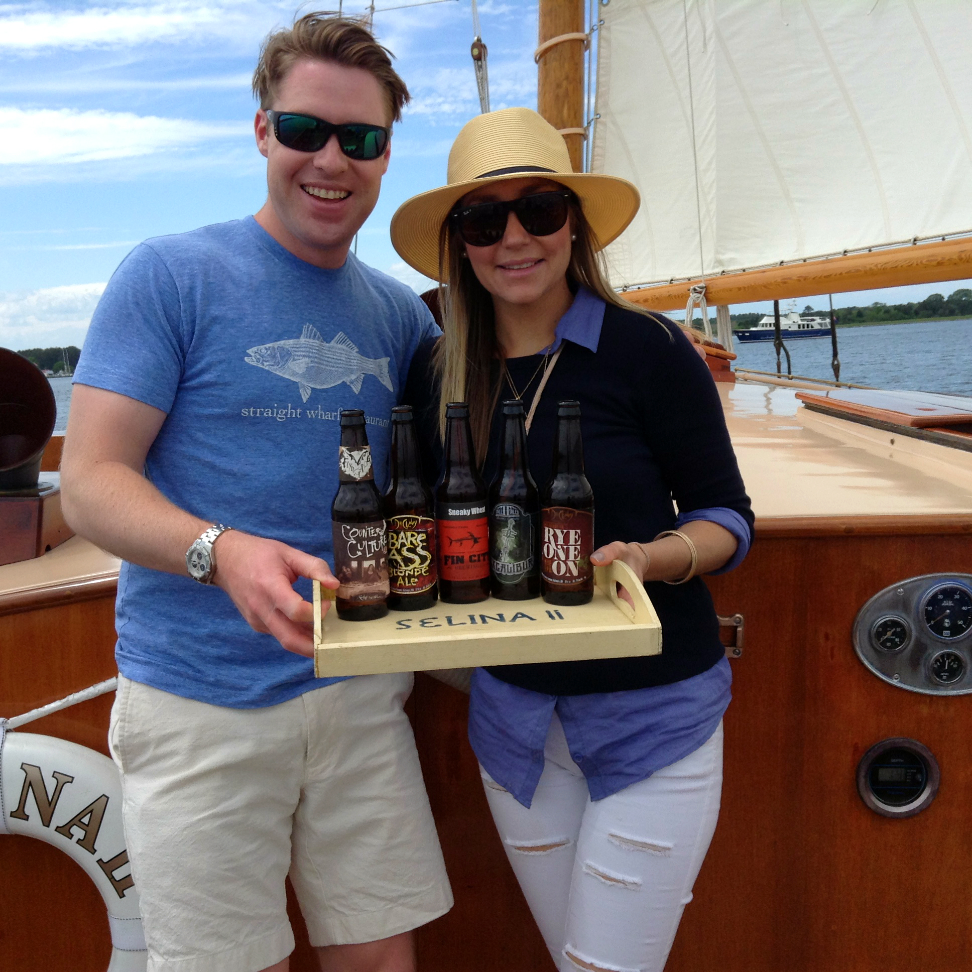 beer-tasting-sail-selina-st-michaels-md-boat-tour-things-to-do Step up your beer game with Sail Selina's private charters in style, yo! 🍺🛥️ This instagram worthy image features a couple holding a tray of Maryland's hoppiest and tastiest microbrews, and soaking up those epic bay views - Book your Sail Selina adventure now, and get ready to rep those beer-cred vibes! 🤘🏼🌊 #HipsterApproved #MarylandMicroBrews #SailSelina #StMichaelsMD