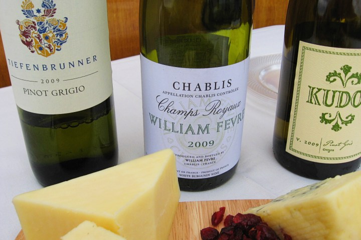 a bottle of wine and a glass of beer on a table