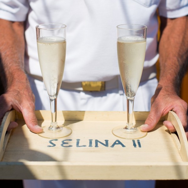 Experience a stunning sunset over the Chesapeake Bay with Sail Selina's Sunset Tour crew in St. Michaels - our first mate serves a tray of fantastic bubbly, the perfect addition to end your day - Book your experience now